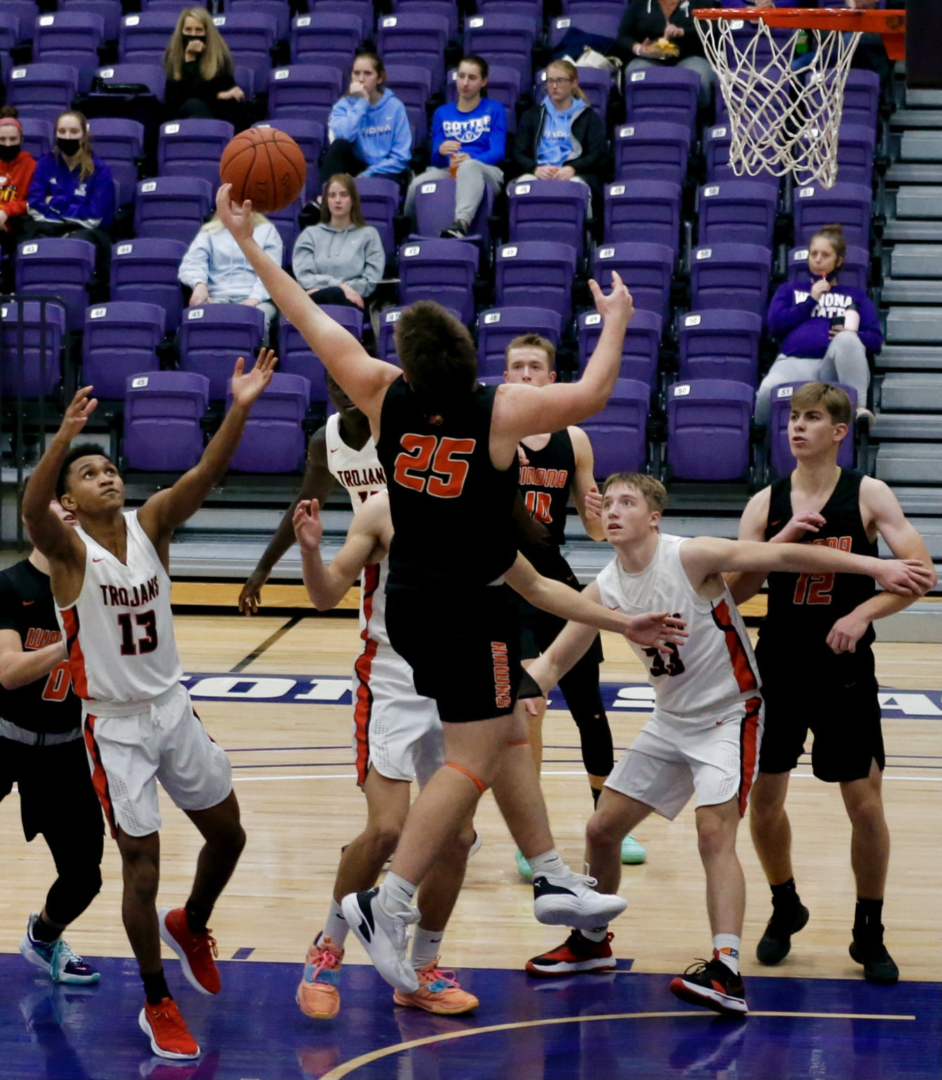 Worthington watches as Wesley Wollan grabs a rebound